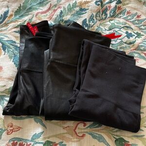 3 pairs of black Spanx leggings